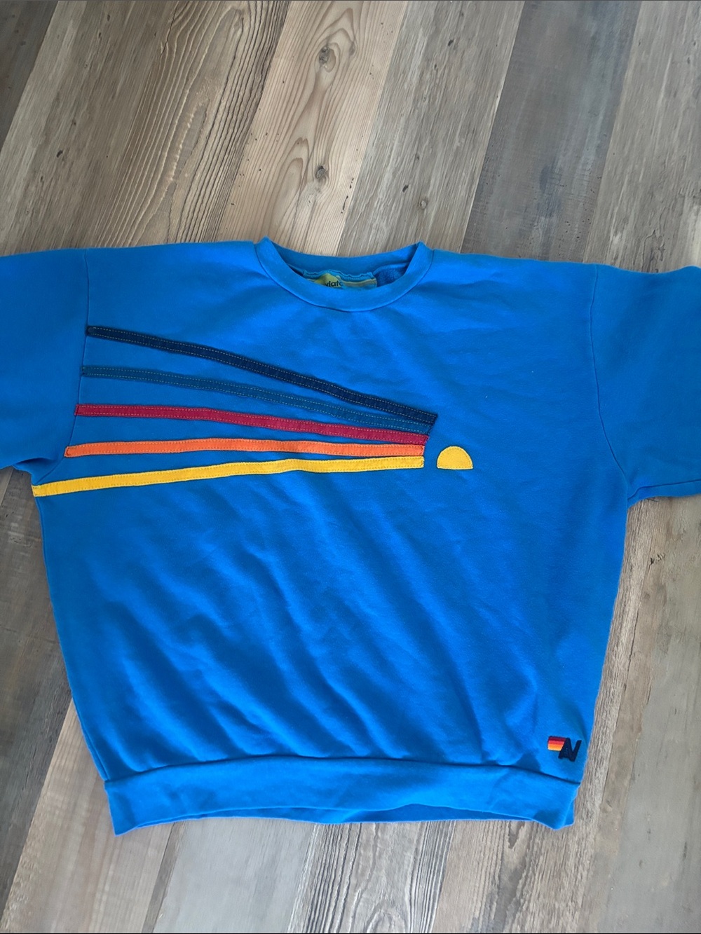 Aviator Nation Bright Blue Graphic Sweatshirt with Rainbow Stripes